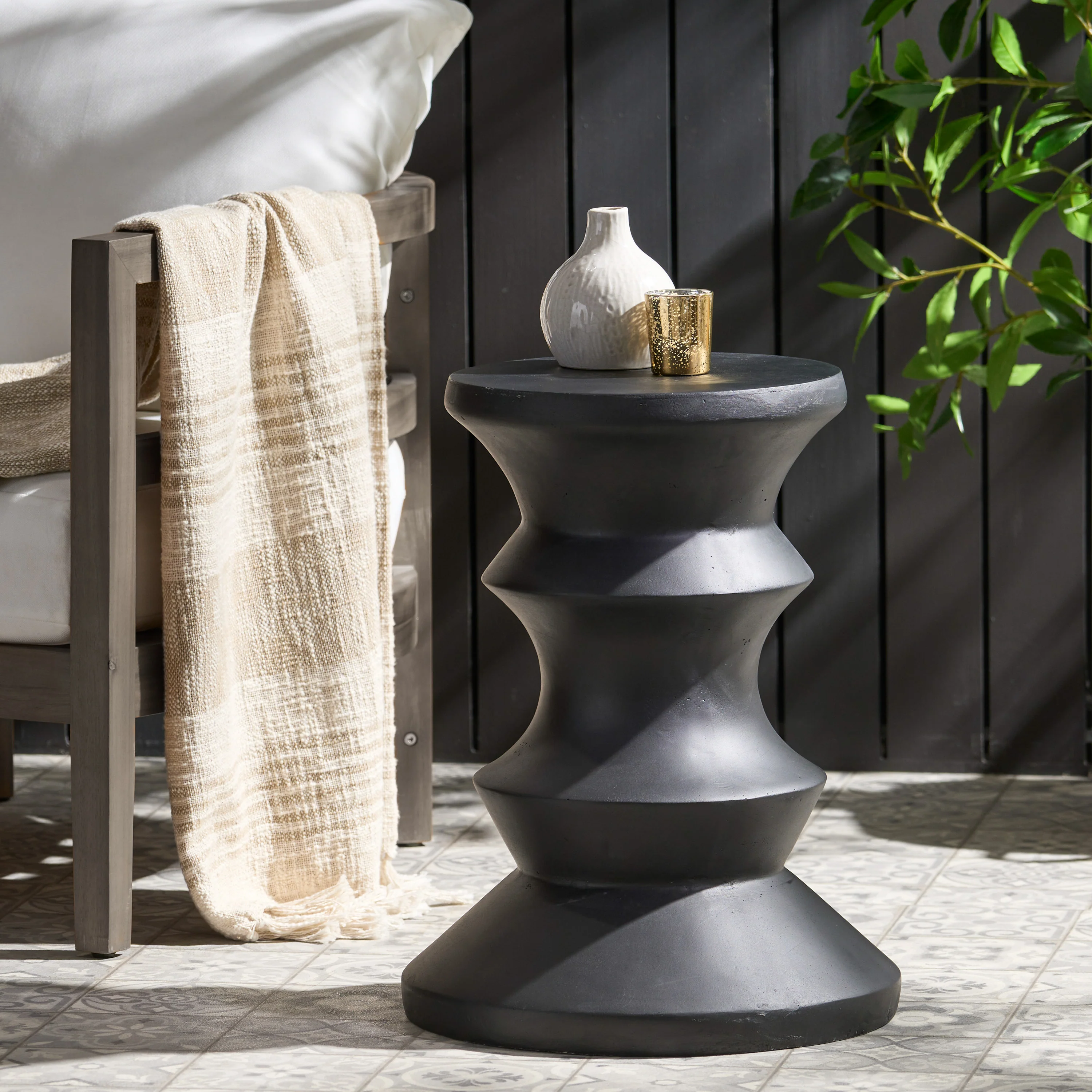 Outdoor End Table with Sculptural Design and Round Table Top