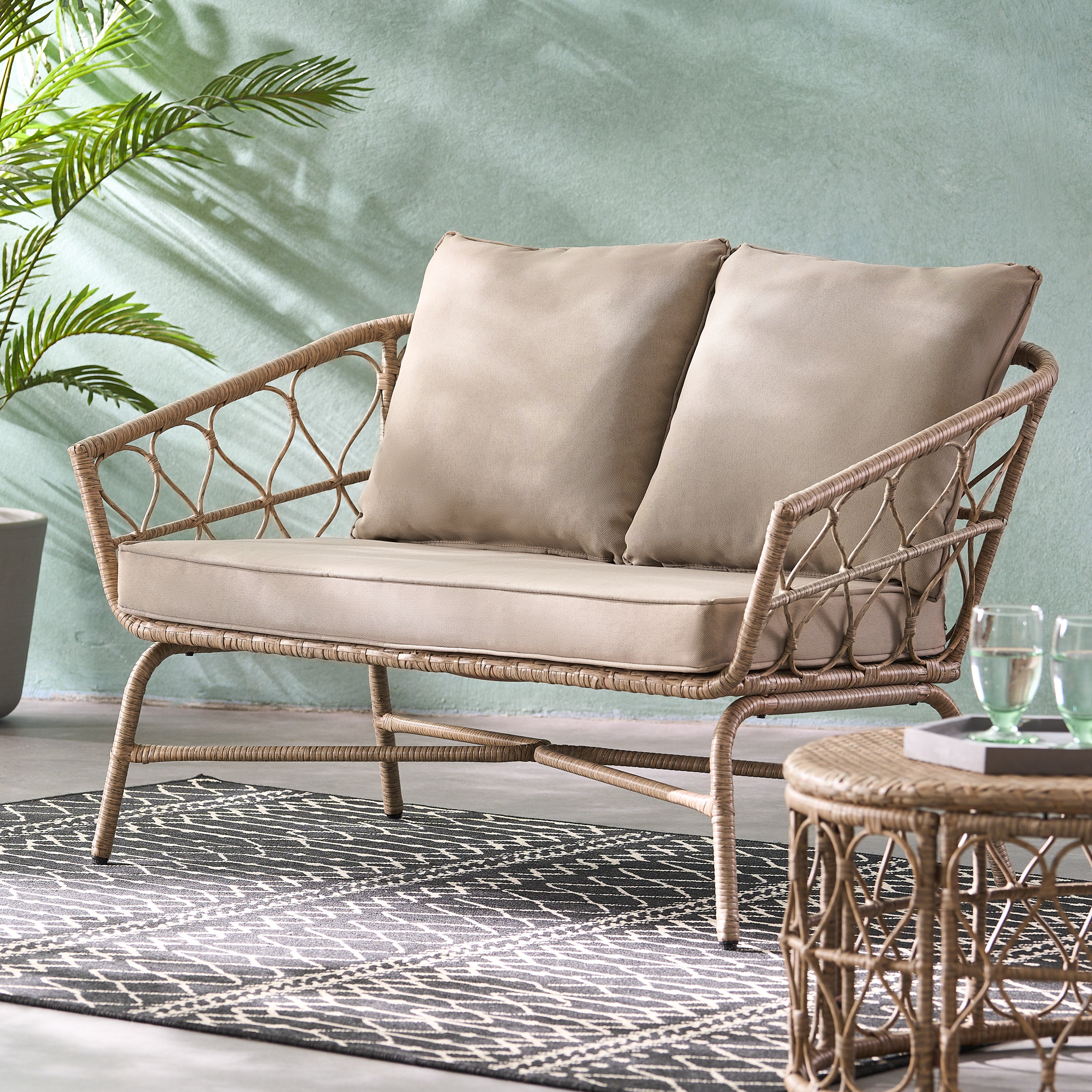 Zircon Outdoor Loveseat with Woven Wicker Weave Design and Back Cushion