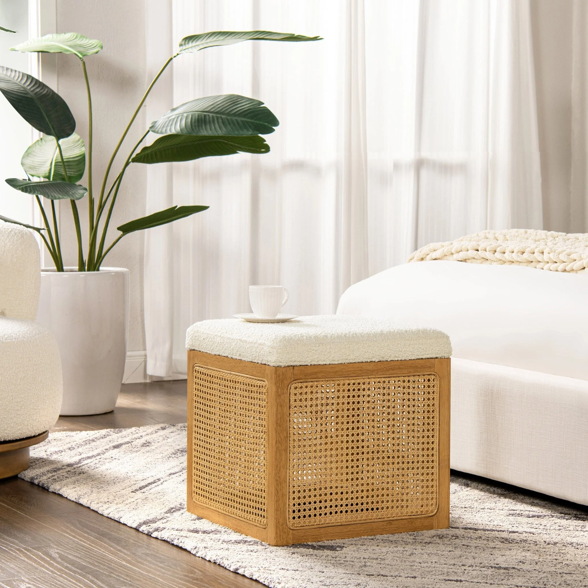 Upholstered Ottoman with Rattan Accents