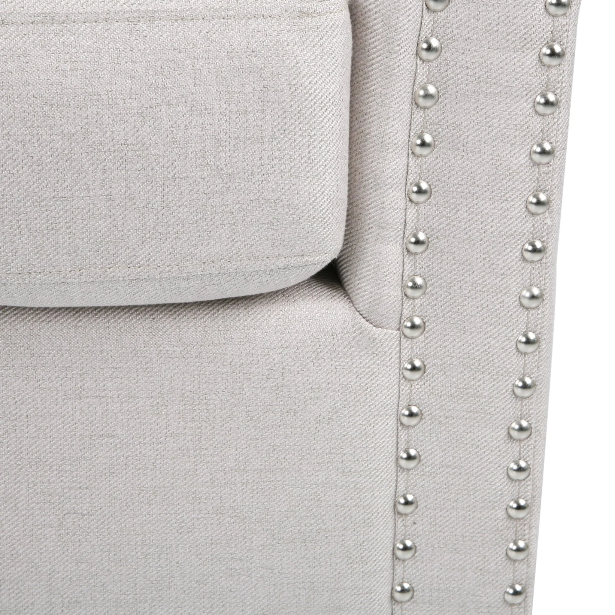 Riverbed Upholstered Swivel Chair with Nailhead Trim and Sloped Arms