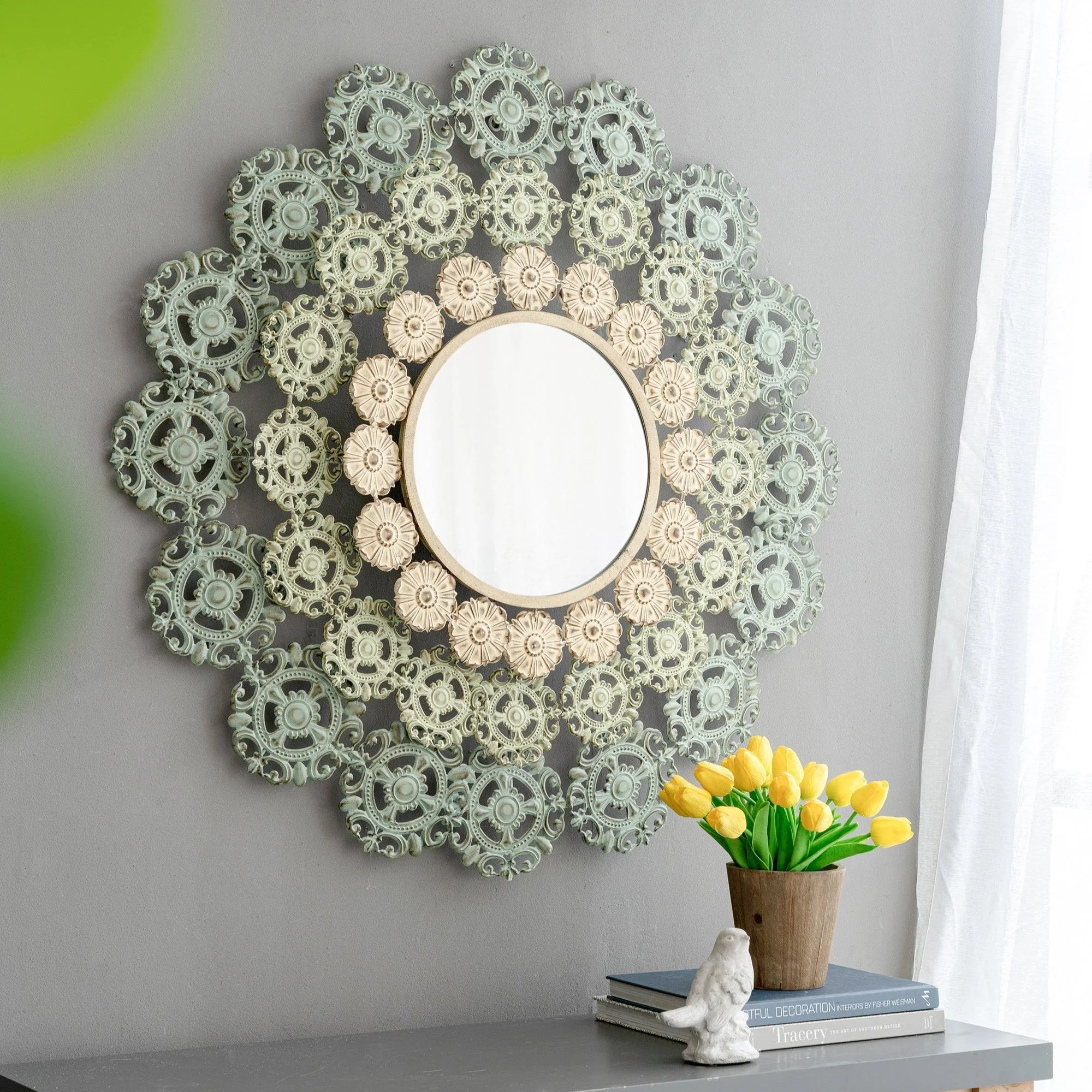 Round Wall Mirror with Floral Accents and Iron Scrollwork