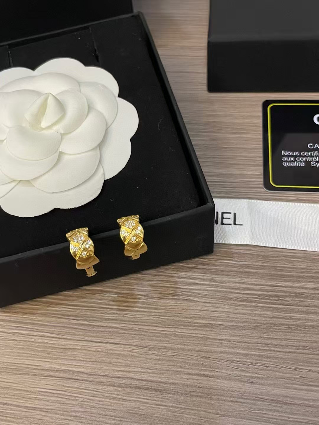 CHANEL quilted pattern earrings