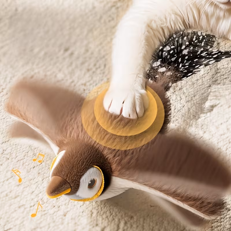 Pet cats and dogs use electric plush cat toys for play. They are modeled after birds and have artificial feathers for tails.