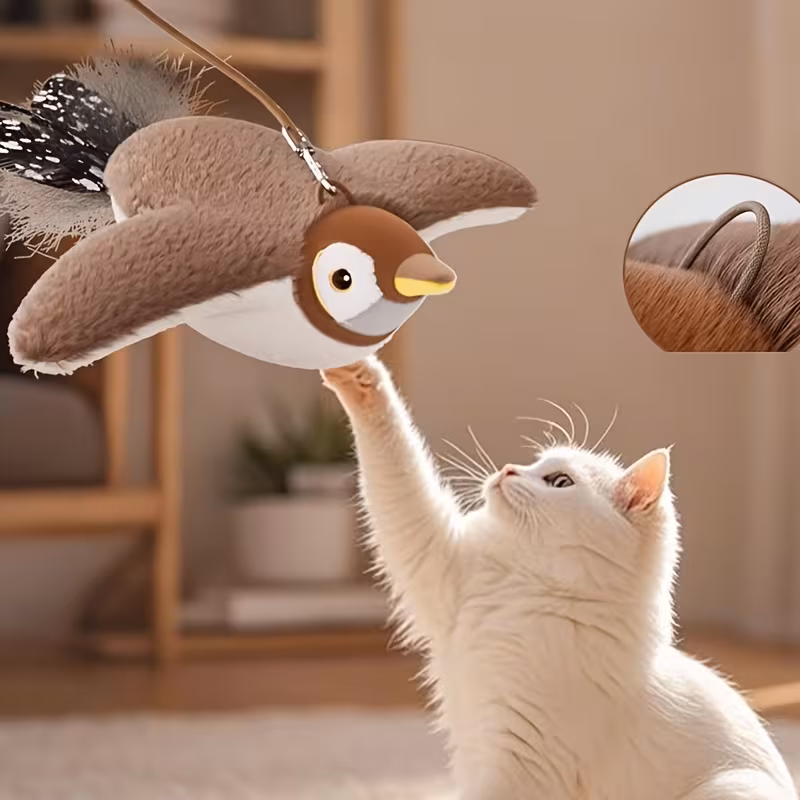 Pet cats and dogs use electric plush cat toys for play. They are modeled after birds and have artificial feathers for tails.