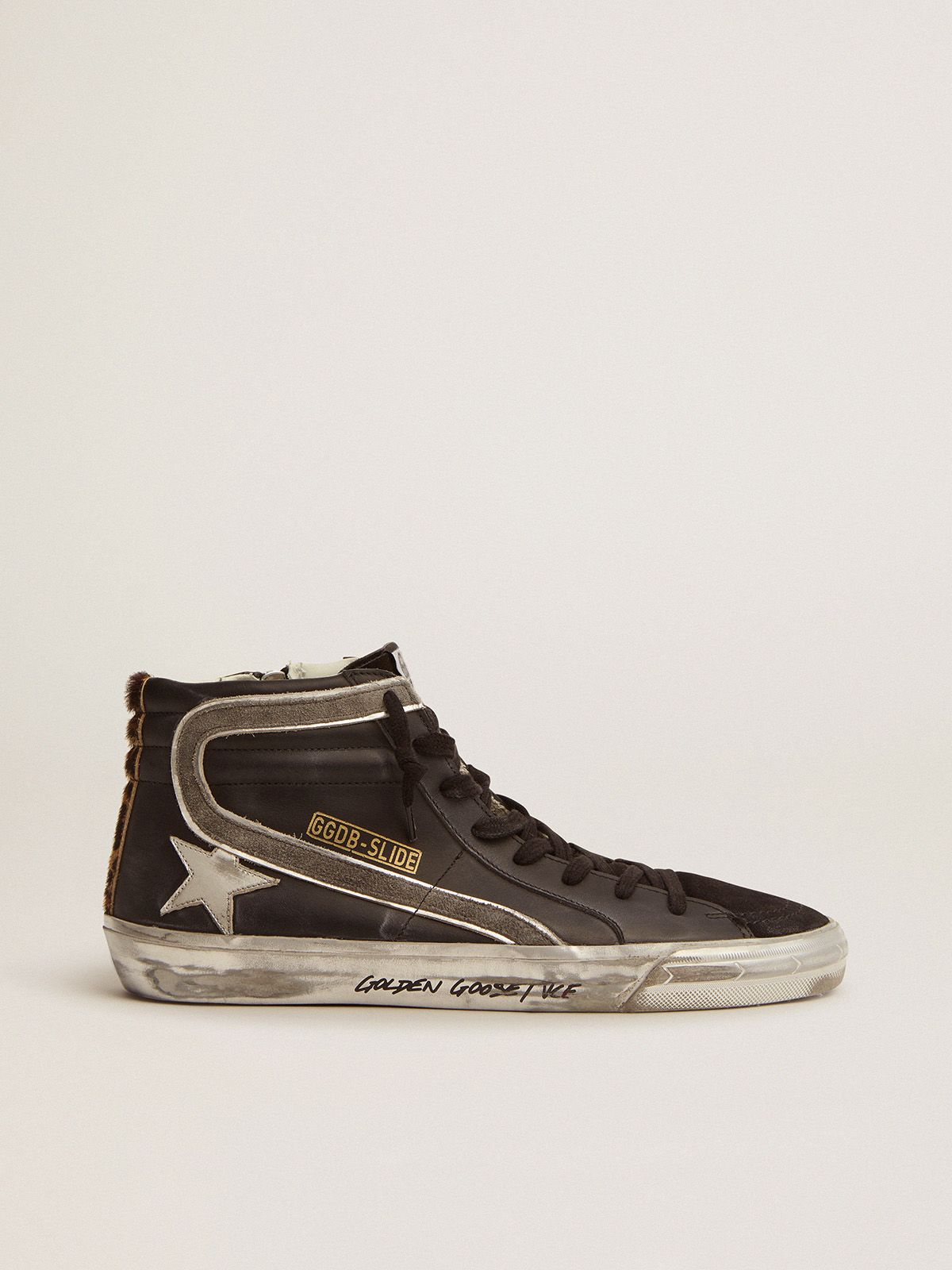 Slide sneakers in black leather with leopard-print pony skin heel tab
