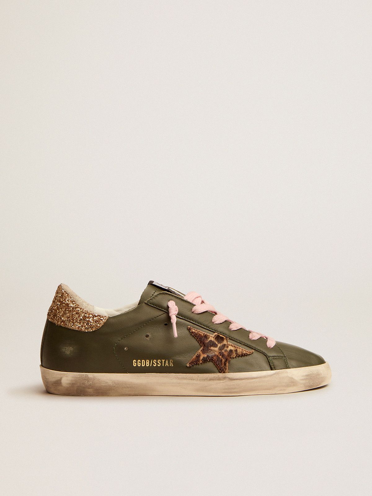 Super-Star sneakers in dark green leather with gold glitter heel tab