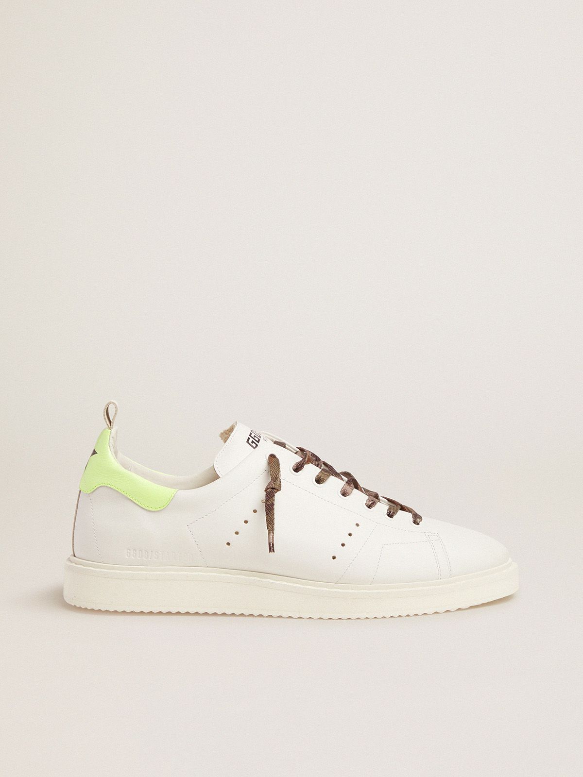 White Starter LTD sneakers with fluorescent yellow heel tab
