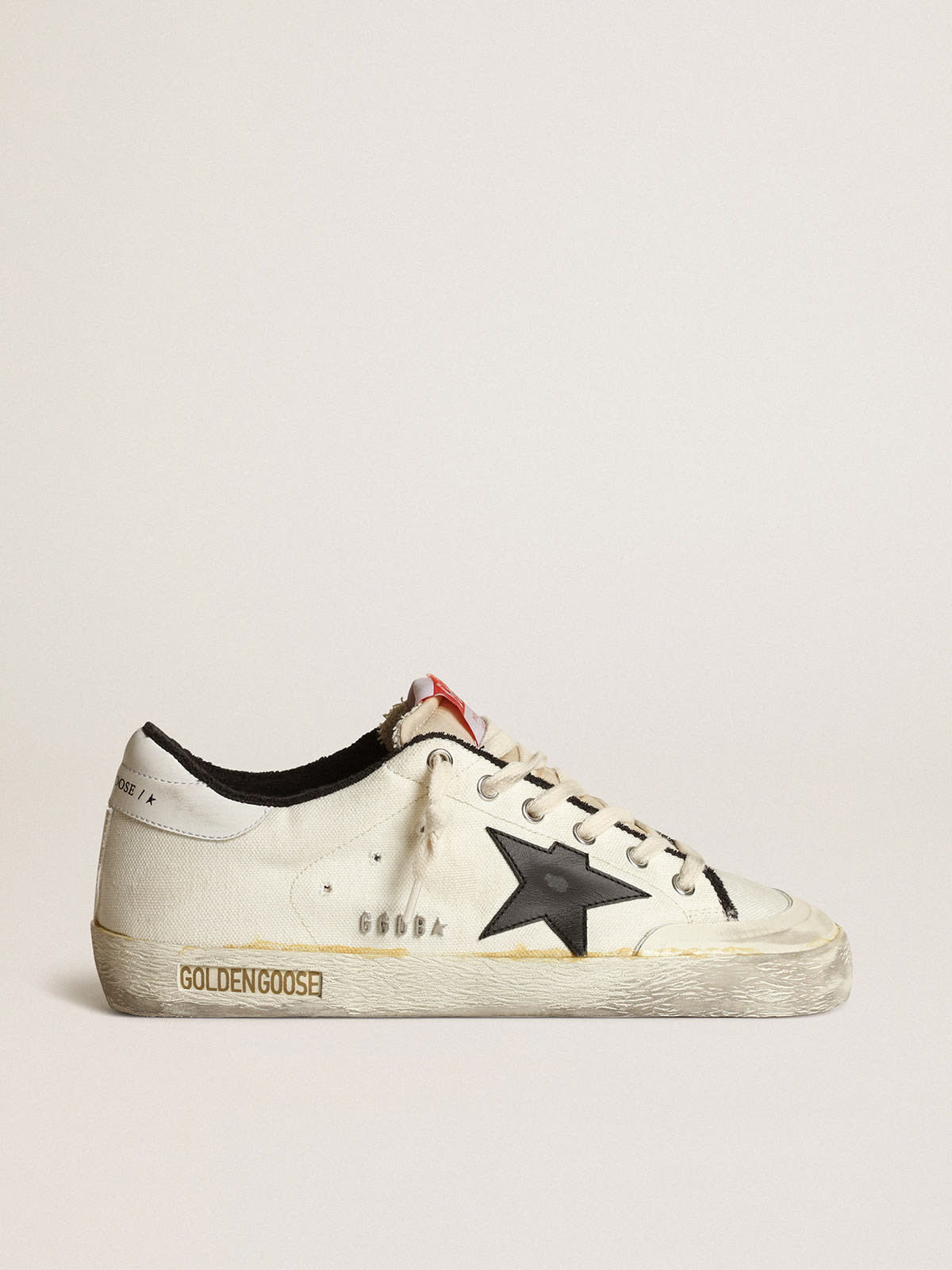 Golden Goose Saldi Women’s Super-Star LTD sneakers in beige canvas with black leather star and white leather heel tab
