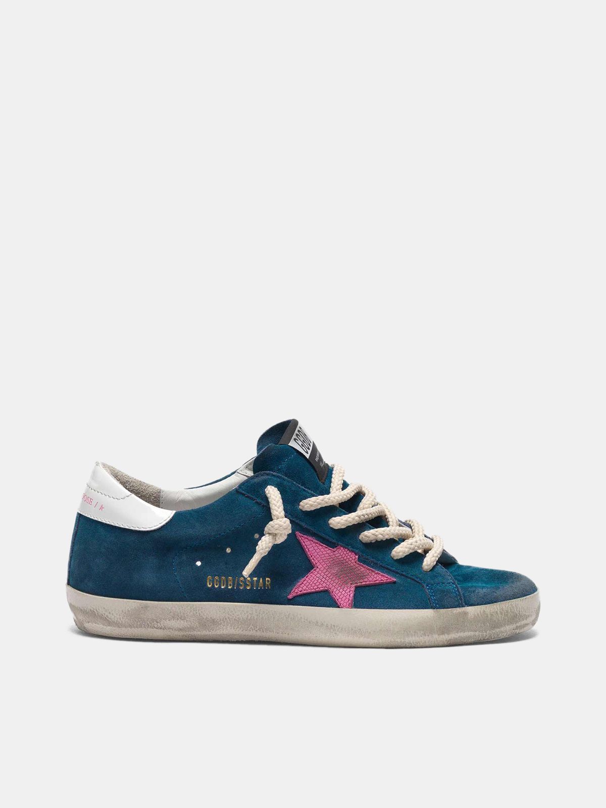 golden goose with a pink suede Super-Star star in blue sneakers