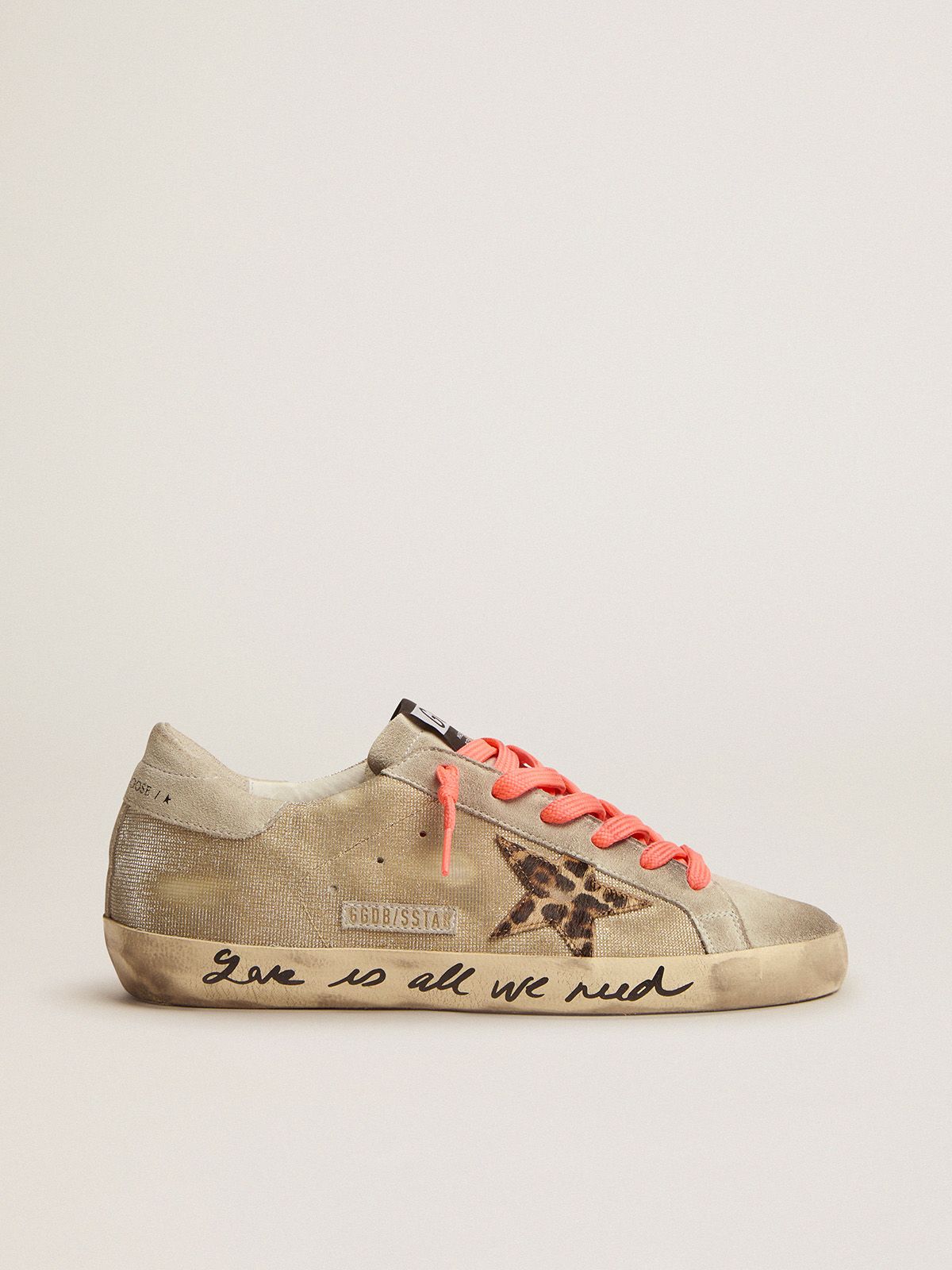 Golden Super-Star sneakers with checkered pattern and hand lettering on the foxing