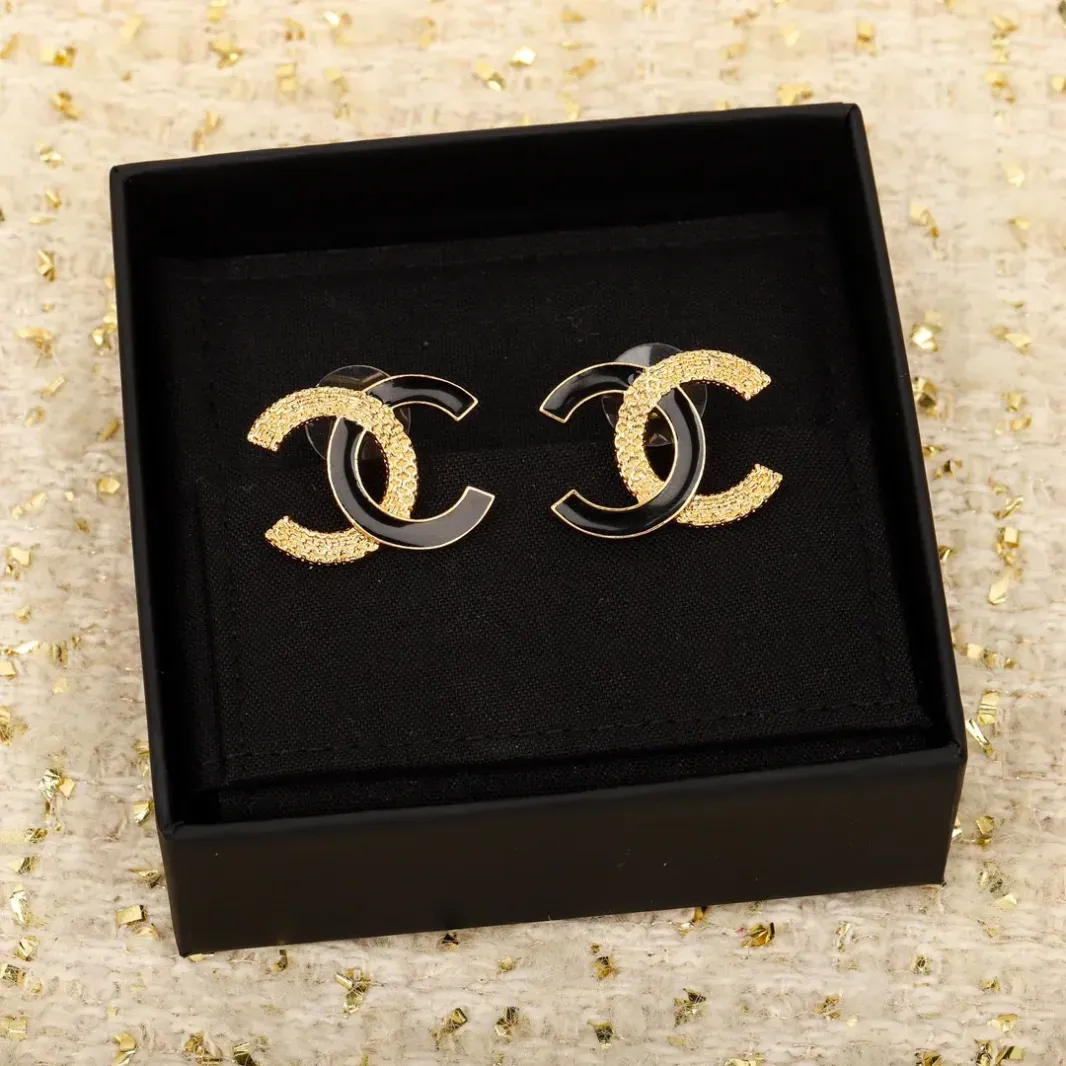 CCE444 CC Black enamel gold embossed stud earrings