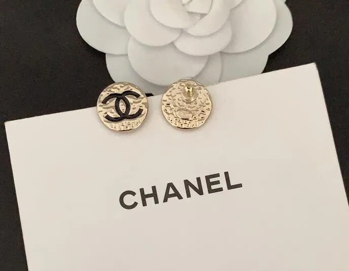 Round black double C earrings