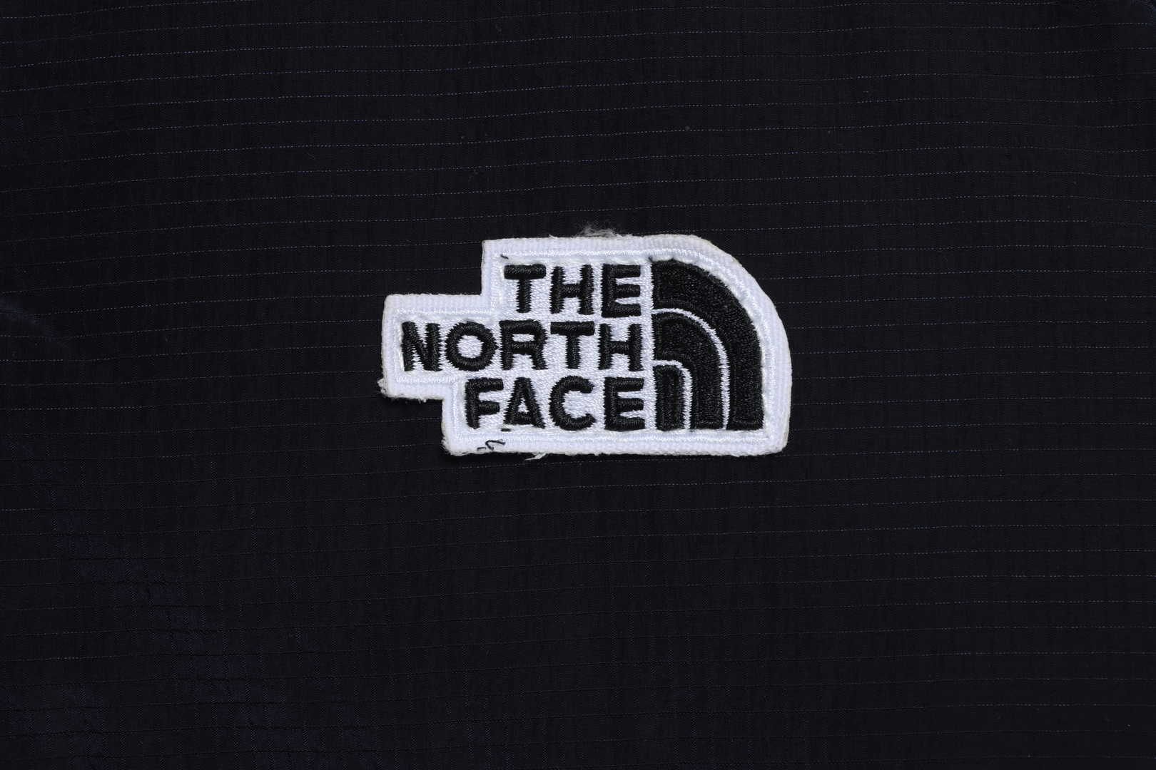 The North Face chest patch micro label down vest