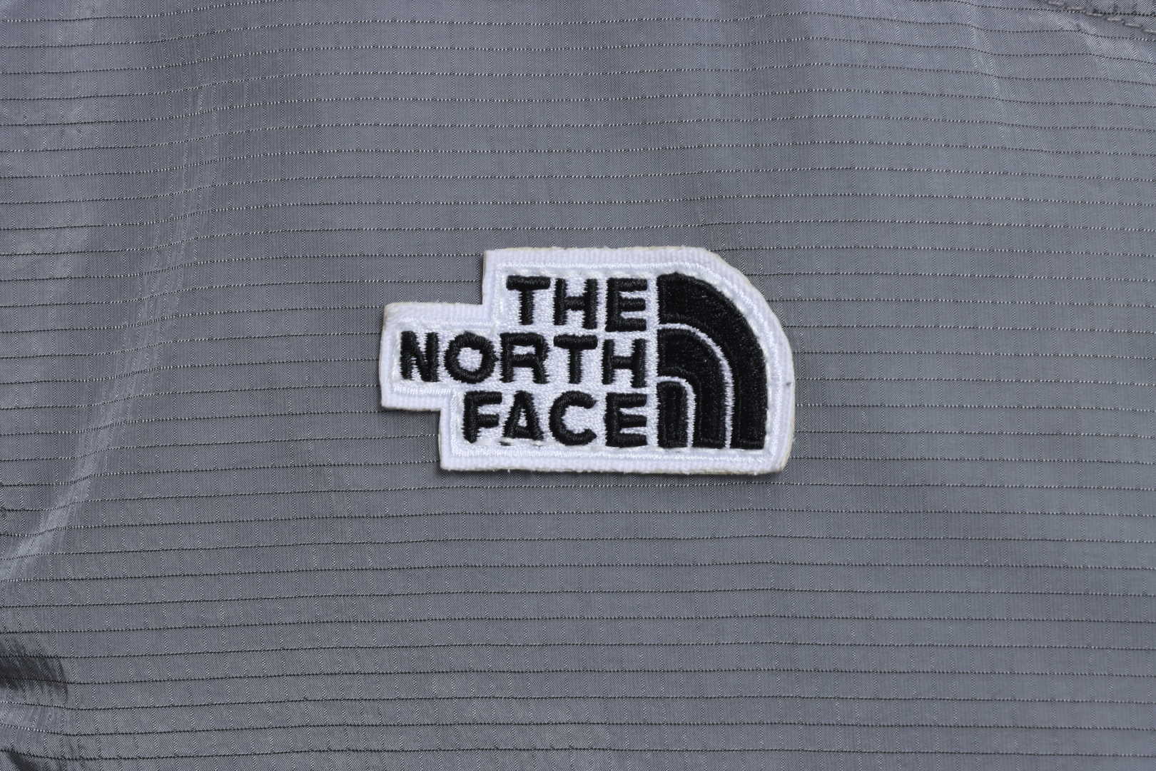 The North Face chest patch micro label down vest