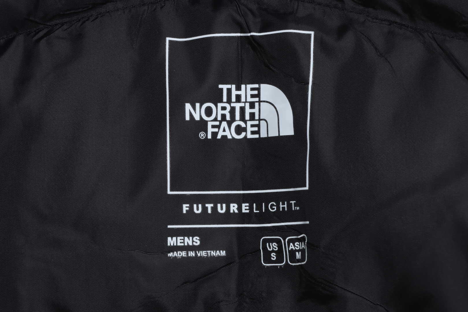 The North Face chest patch micro label down vest