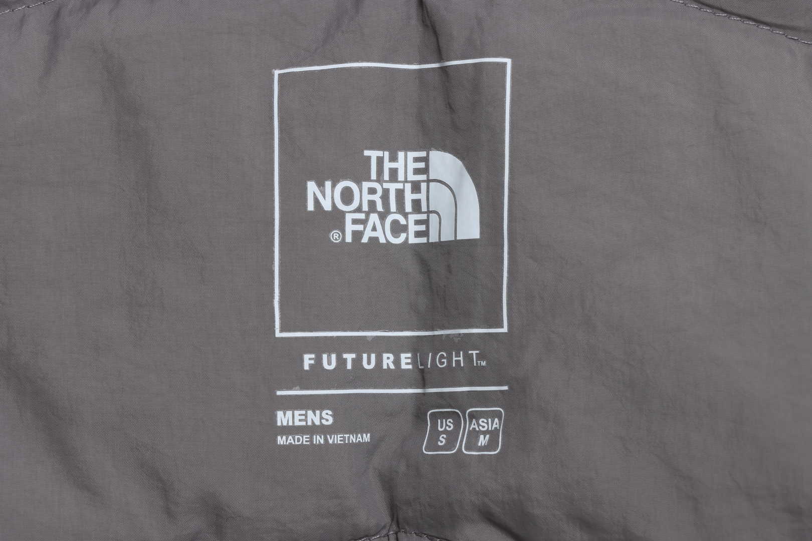 The North Face chest patch micro label down vest