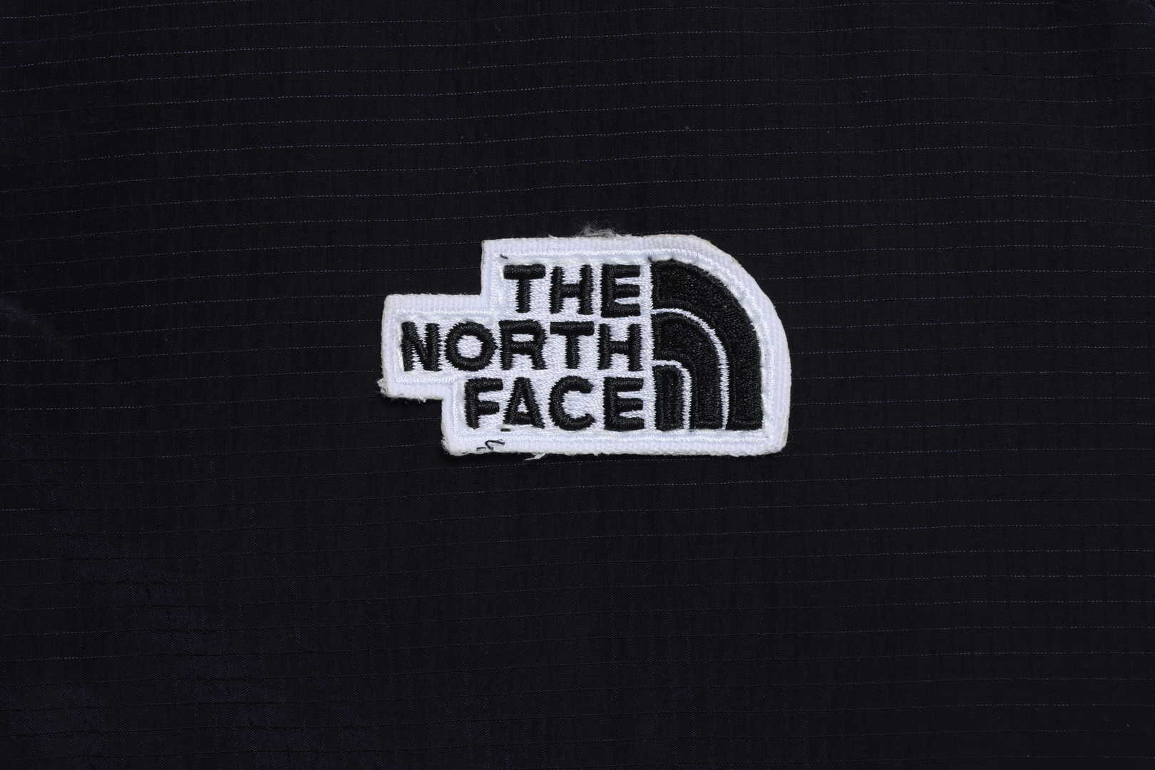 The North Face chest patch micro label down vest