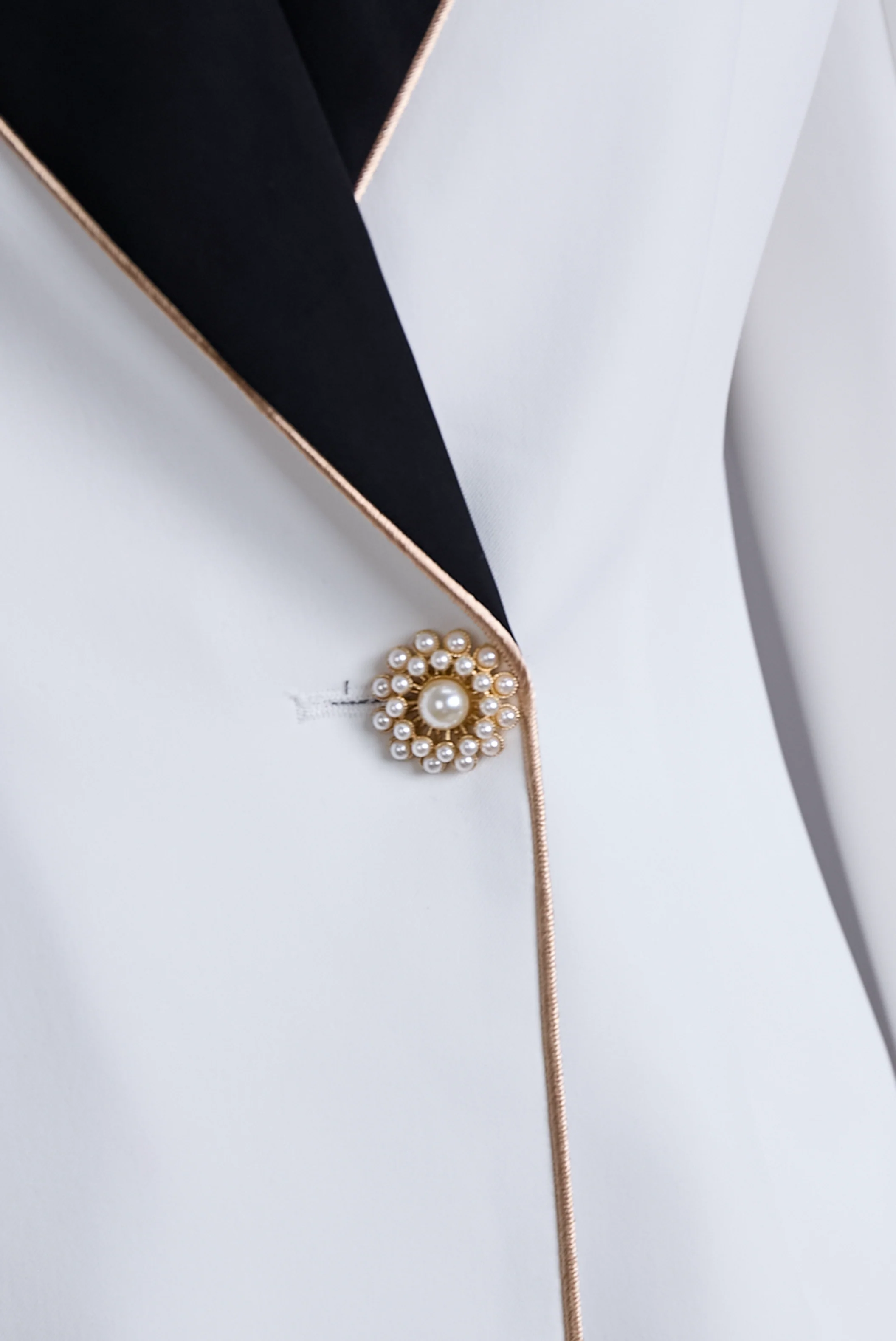 Elegant Asymmetrical White Blazer with Black Contrast Lapels