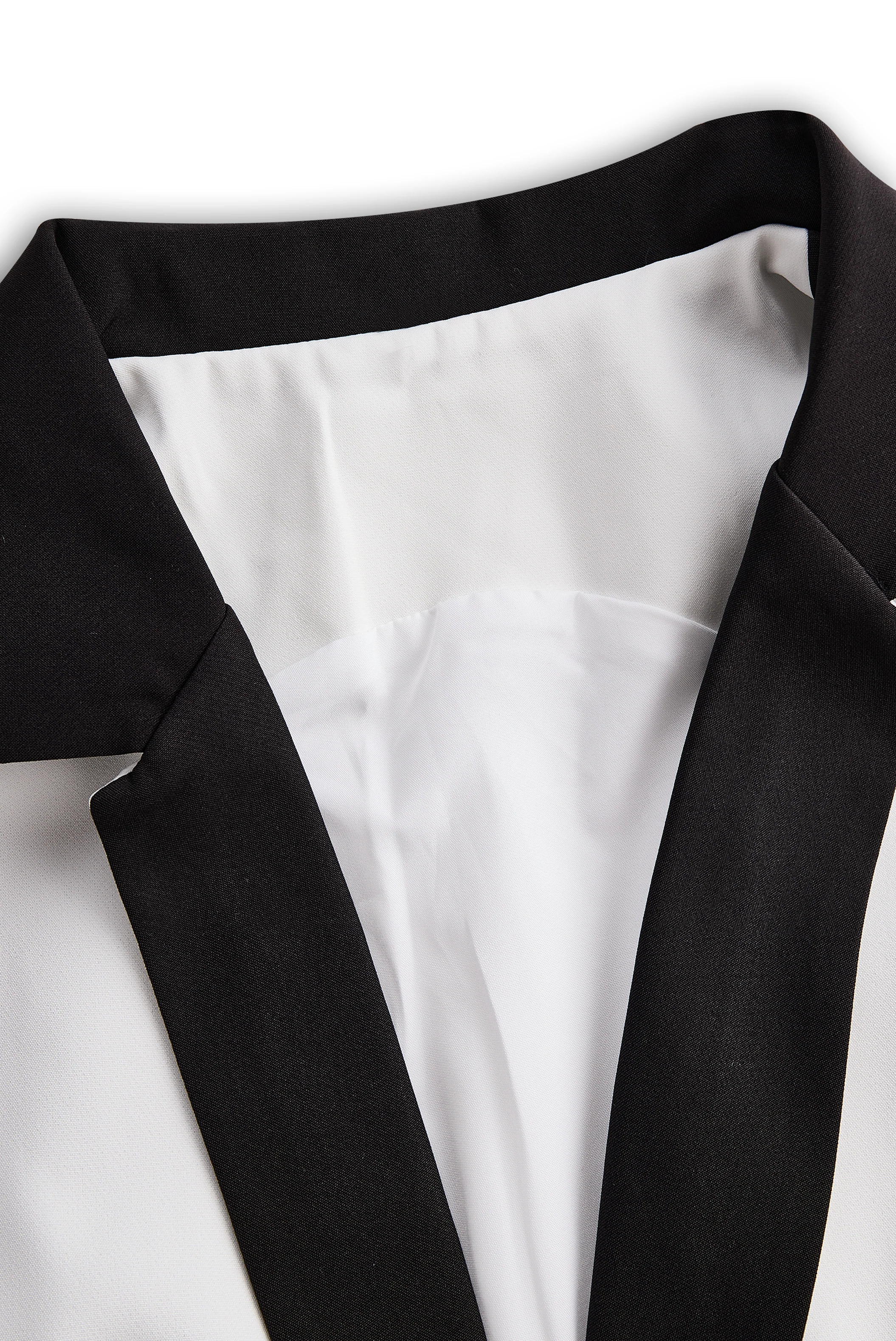 Sleek White Jumpsuit With Dual Button Detail And Black Lapel