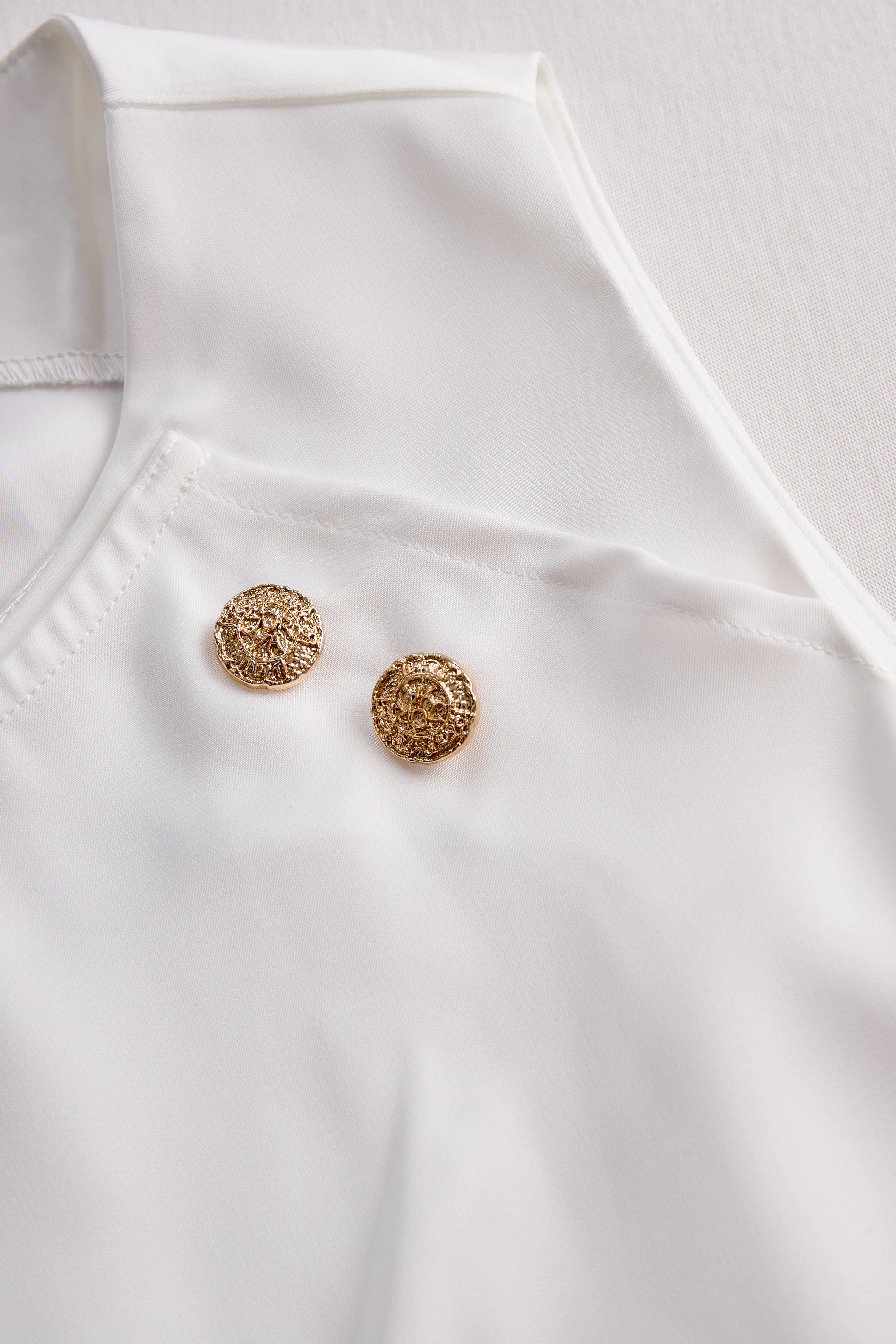 Elegant White Draped Top with Button Detail