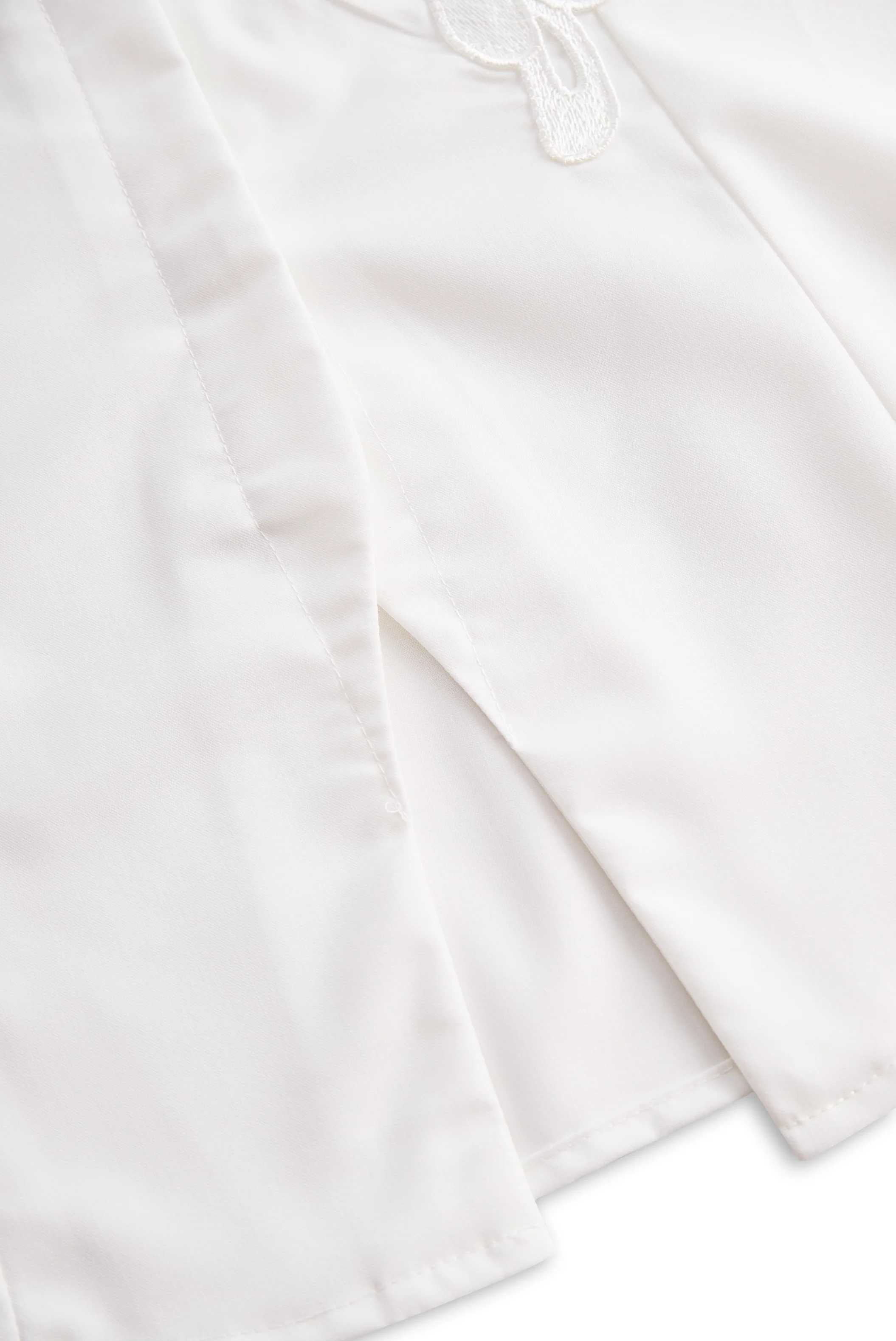 Sleeveless Shirt with 3D Floral Appliqué