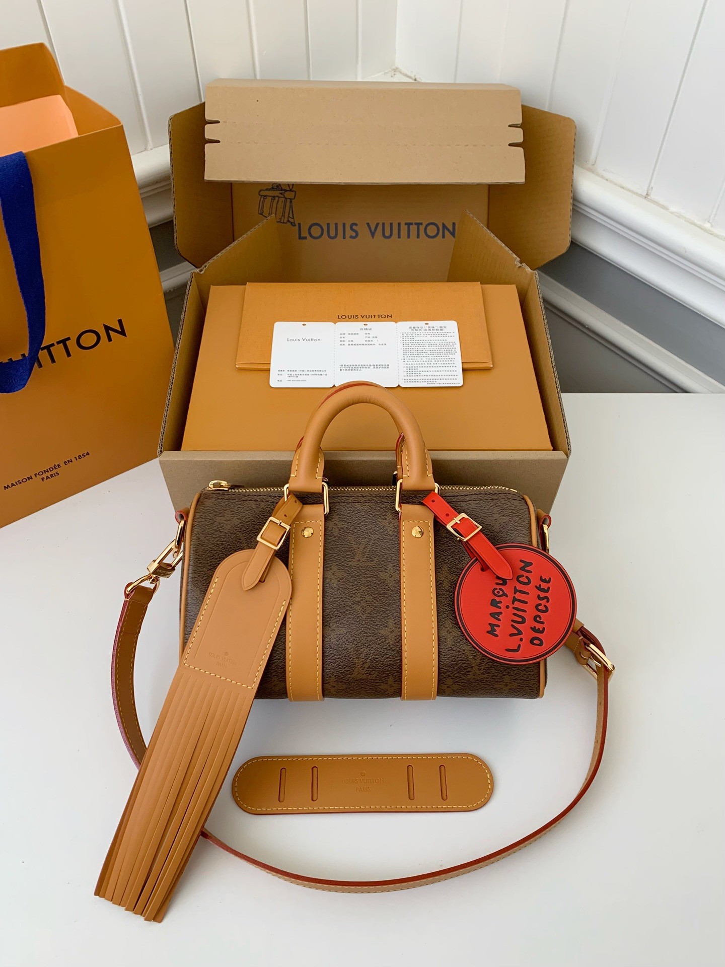 L X V The New Keepall Bandouli &egrave;re 25 handbag  M11542  Size：25*15*11cm