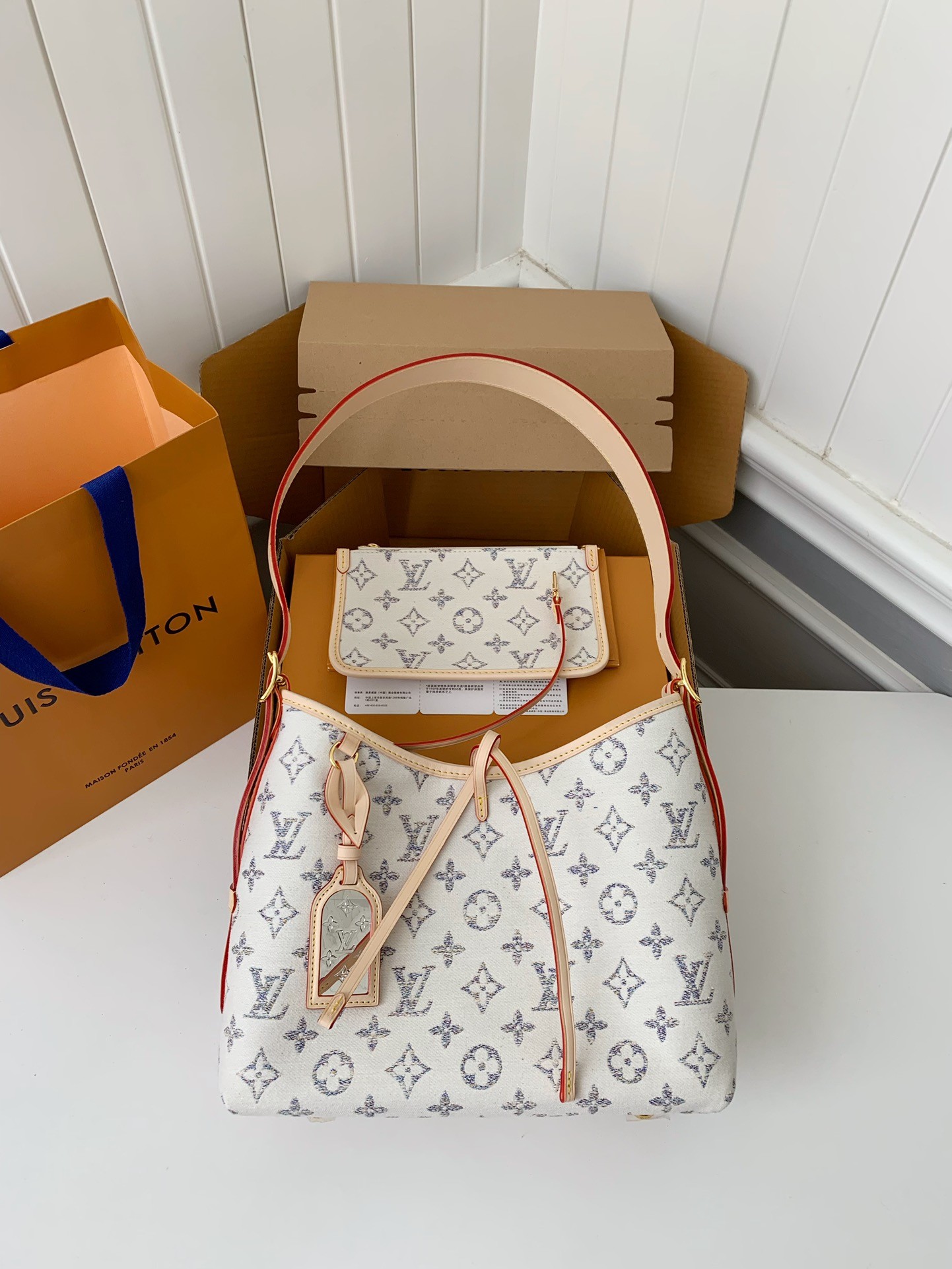 L X V Carryall small handbag M24707  Size：29*24*12cm