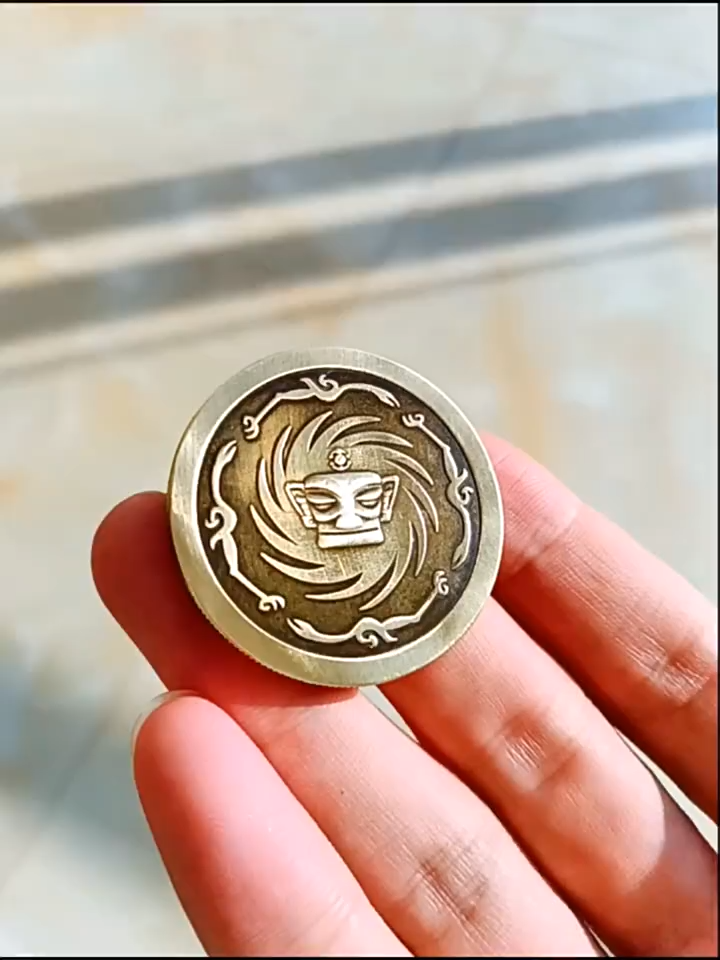 Sanxingdui gold mask coin